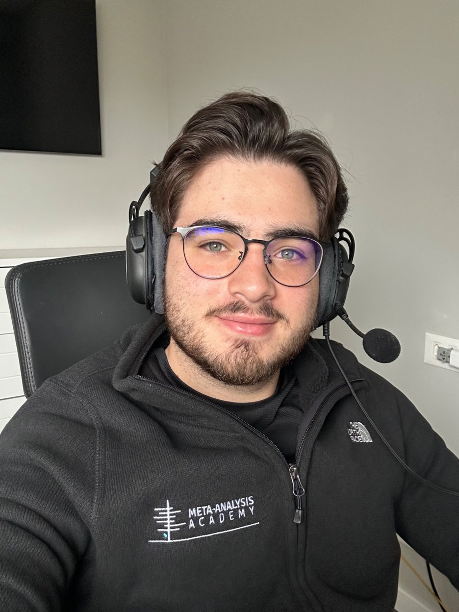 Lucas at his desk with a headset, mentoring online
